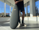 Man holding a Black & Gold Balance Board for Pros - ToyBoard