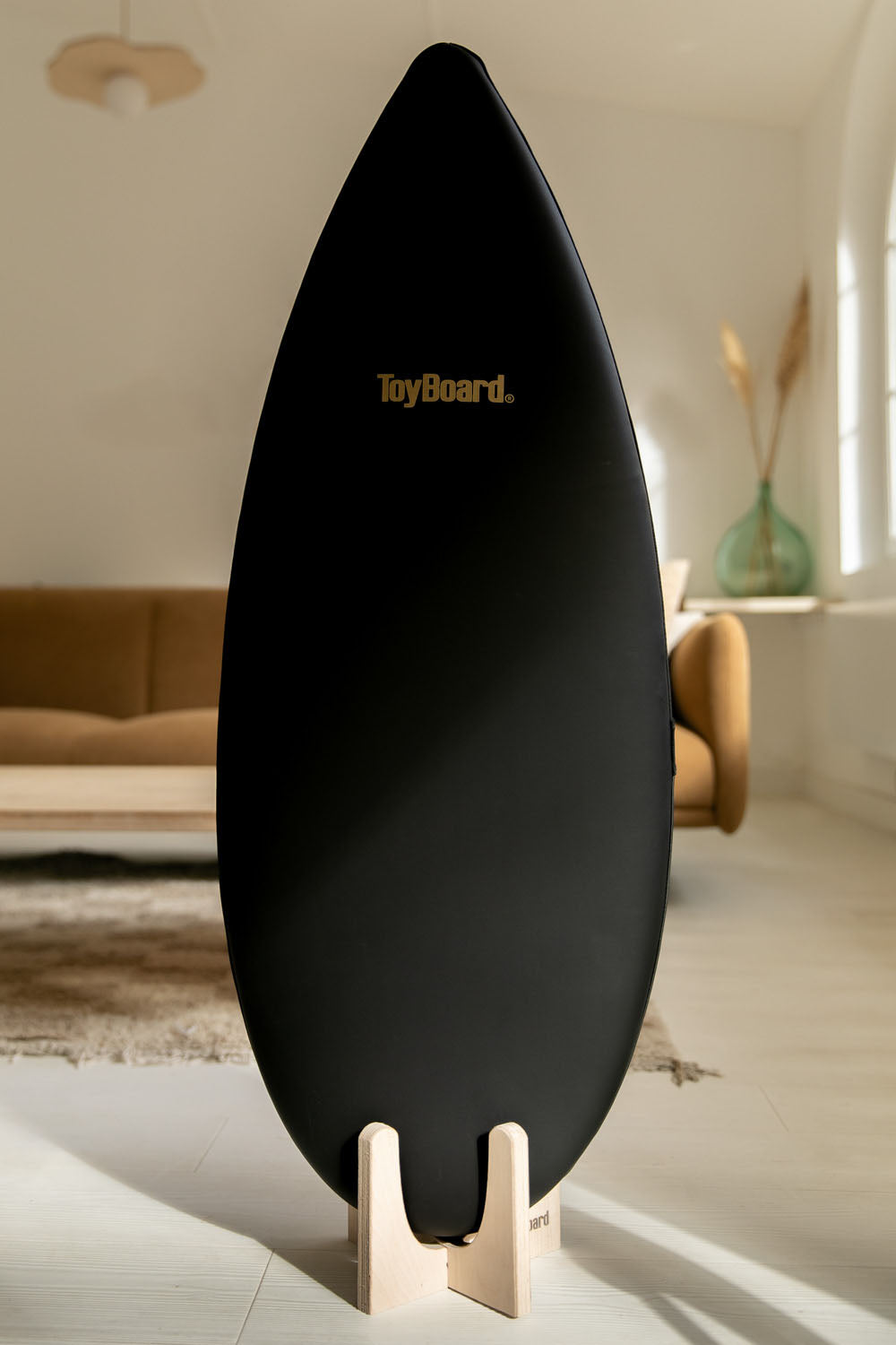 The Deluxe Black Gold Balance Board for Pros - ToyBoard on a stand